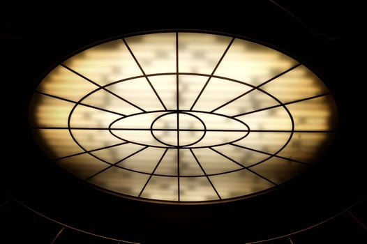 Conceptual high contrast shot of oval lighting at the ceiling photo