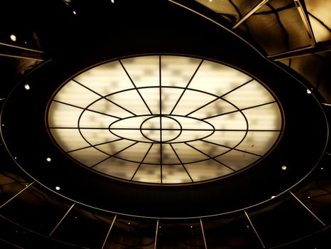 Conceptual high contrast shot of oval lighting at the ceiling photo