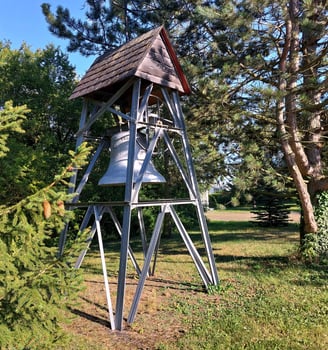 Bell cage in churchyard of catholic church in Germany photo