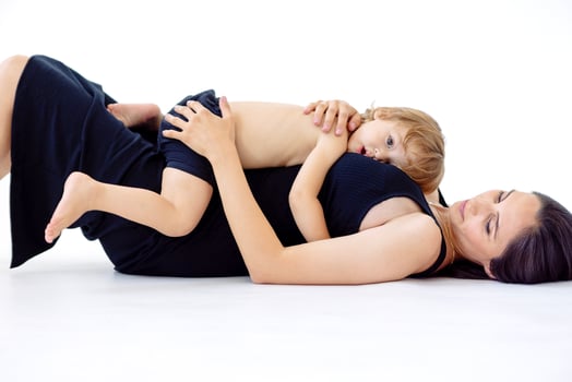 Closeup of a cute baby with a charming mom in casual clothes photo