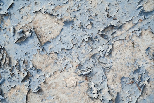 Peeling paint on the wall. a concrete wall with old cracked flaking paint photo