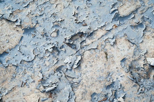Peeling paint on the wall. a concrete wall with old cracked flaking paint photo