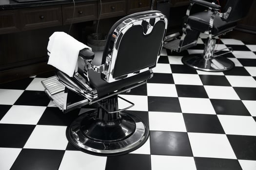Classic barber chair in a stylish black and white shop interior photo