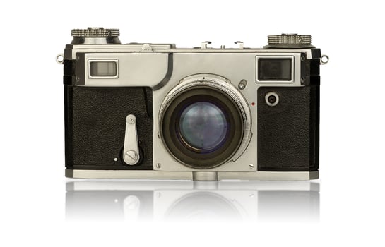 Old camera isolated on a white background. Vintage film camera with retro lens isolate. 19th century photo