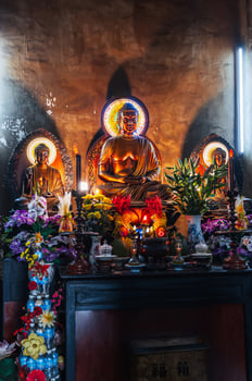 Buddha statues inside the temple at Long Son Buddhist Pagoda in Nha Trang in Vietnam photo