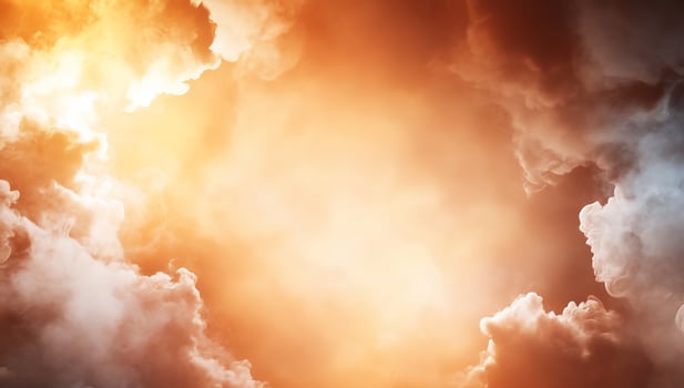 A dramatic sky filled with orange and gray clouds, evoking emotion. photo