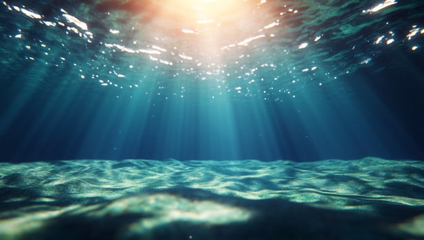Underwater scene with sunlight shining through the water photo