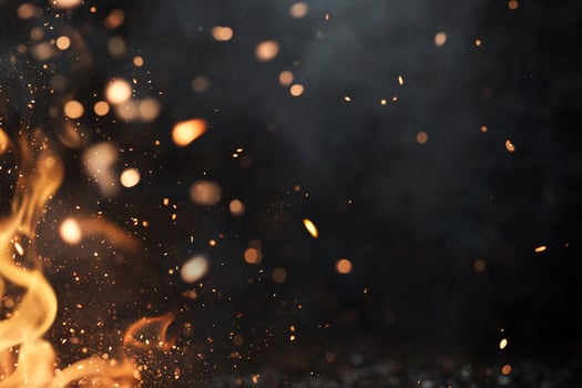 A dynamic image of flames and sparks against a dark background. photo