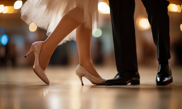 Close-up of dancing feet in elegant shoes on a dance floor. photo