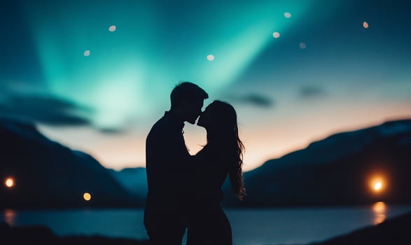 A romantic silhouette of a couple against the aurora borealis. photo