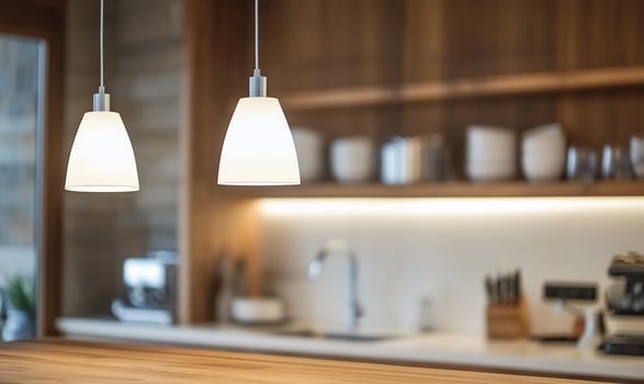 Modern kitchen with pendant lights and wooden shelves. photo
