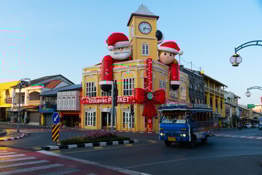 Phuket, Thailand-January 3, 2025-Phuket local bus and Museum Phuket, the old chino-portuguese building style in the city of Phuket during new year festival. photo