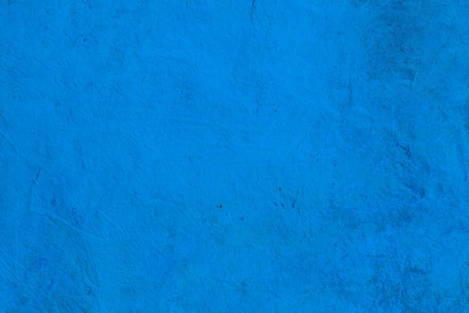 Bright blue texture with natural rough patterns and subtle imperfections, ideal for creative backgrounds or designs. photo