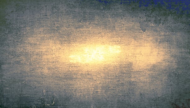Artistic grunge texture featuring a warm golden glow in the center with a weathered, vintage-style overlay. photo
