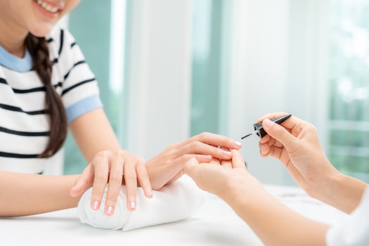 Woman receive care service by professional Beautician Manicure at spa centre. Nail beauty salon use nail file for Glazing treatment. manicurist make nail customer to beautiful. body care spa treatment photo
