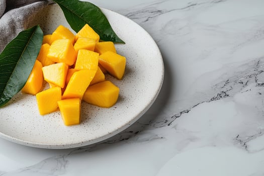 Close up of fresh mango cubes on a plate photo