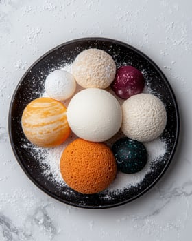 Close up of a plate of colorful, textured dessert spheres resembling planets photo