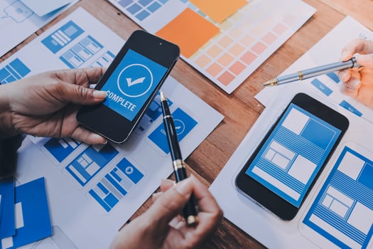 A person is using a smartphone to look at a design photo