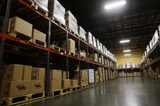 A warehouse with boxes and pallets on the shelves photo