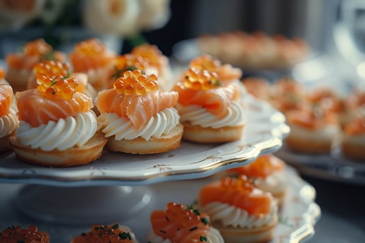 A plate of mini desserts with salmon on top photo