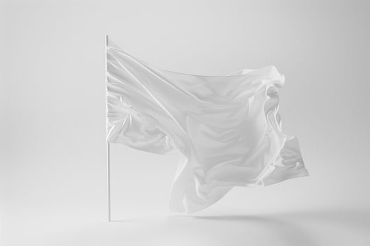 White flag waving in the wind on a gray background photo