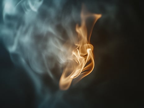 Close Up of a Flame in the Smoke Highlighting the Dramatic Contrast of Fire and Haze photo