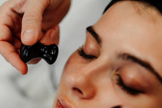 Beauty treatment session focusing on facial massage in a serene spa environment photo