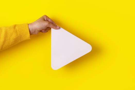 hand holding media player button photo