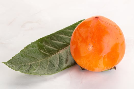 Fresh ripe sweet juicy persimmon photo