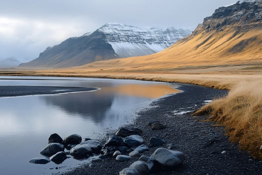 Calm river flowing at the foot of snowy mountains in iceland photo