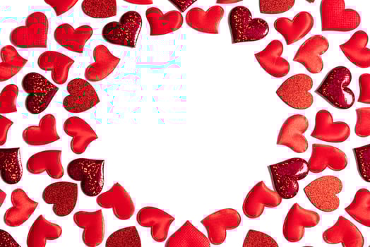Glittering red hearts frame. Concept love banner, valentine's day greeting card, wedding invitation, birthday poster. Hearts romantic pattern for Happy Women's, Mother's, Day. Photo. Copy space photo