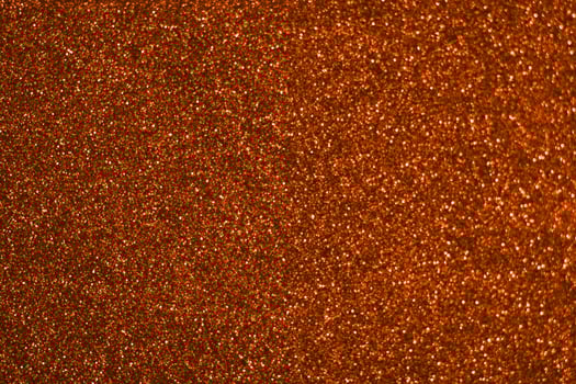 A close up of a red glittery surface photo