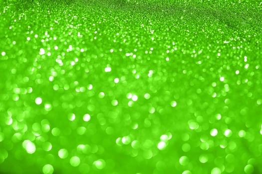 Green glitter background with lots of lights photo