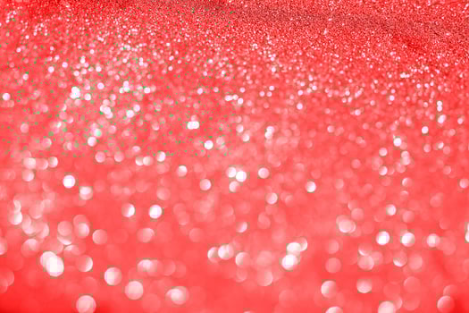 Red glitter background with white lights photo