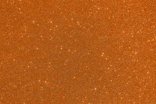 A close up of a large orange surface with a few small dots photo