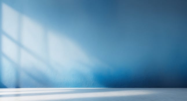 A captivating blue gradient abstract studio wall backgroundA captivating blue gradient abstract studio wall background. photo
