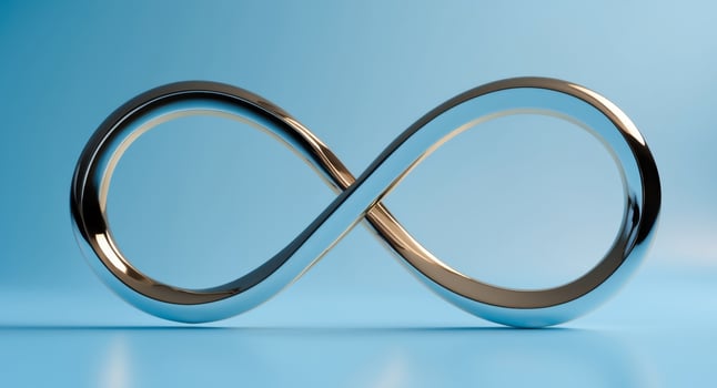 metallic infinity symbol on blue background photo