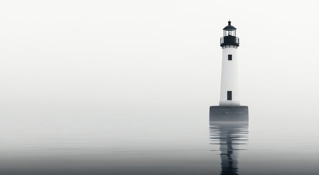 A black and white photo of a lighthouse in the fog