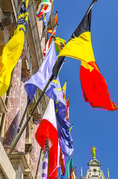 European countries flags on facade of Antwerp City Hall Stadhuis Antwerpen in Antwerp city historical centre, vertical view, Flemish Region, Belgium photo