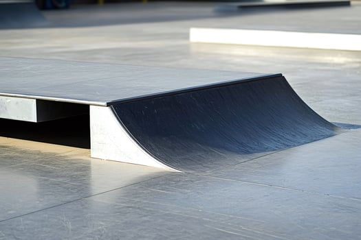 Skatepark ramp detail showing metal and concrete surfaces photo