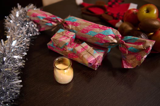 Colorful Wrapped Gifts on a Table With Candlelight and Festive Decor photo