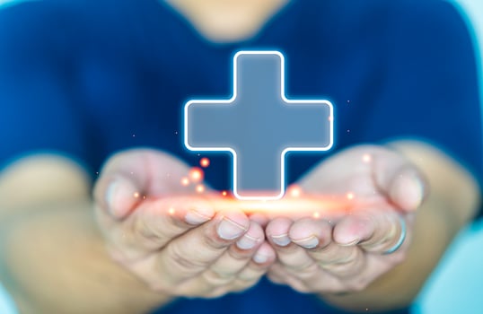 Health insurance and medical welfare concept. Man hands holding plus symbol and healthcare medical icon photo