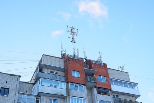 Telecommunication Equipment Installed on the Rooftop of an Apartment Building in the City photo