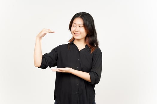 Measuring and Showing Big Sign Product of Beautiful Asian Woman Isolated On White Background photo