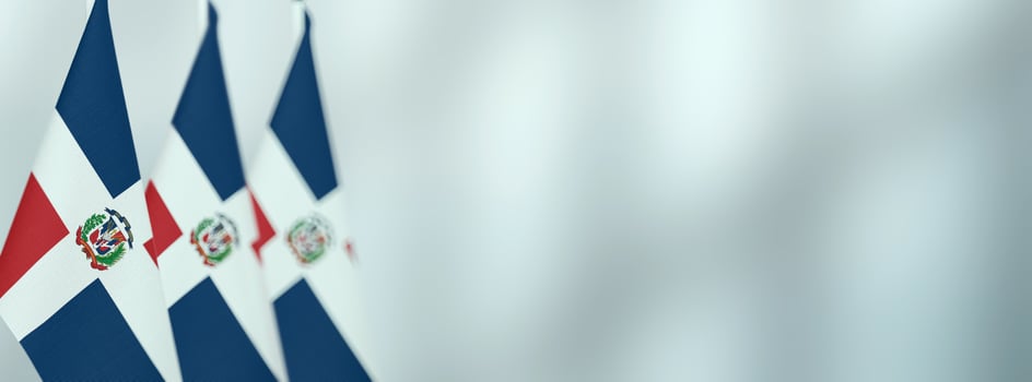 Dominican Republic table flags in the office, banner background with space for text photo