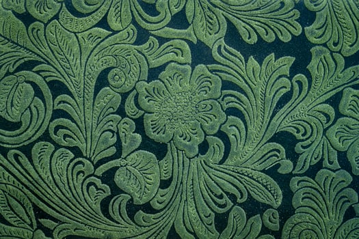 Tooled leather floral pattern background photo