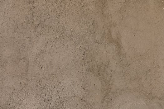Rough textures of adobe walls reveal the beauty of traditional craftsmanship in a sunlit desert landscape photo