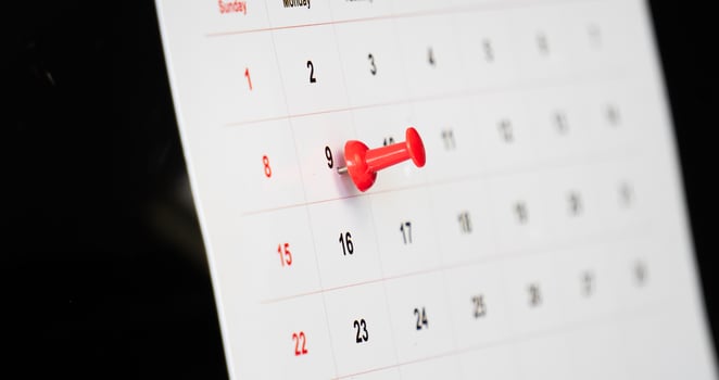 Important day with red pin on sitting calendar photo