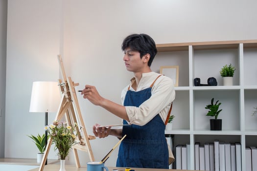 Artistic expression young artist painting in a modern studio indoor setting creative process perspective photo