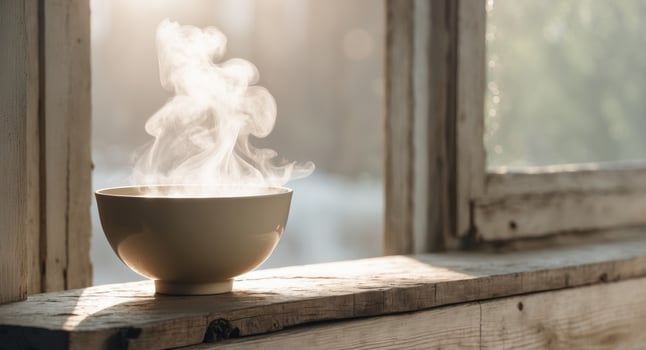 A Cozy Still Life with a Steaming Bowl on a Wooden Windowsill photo